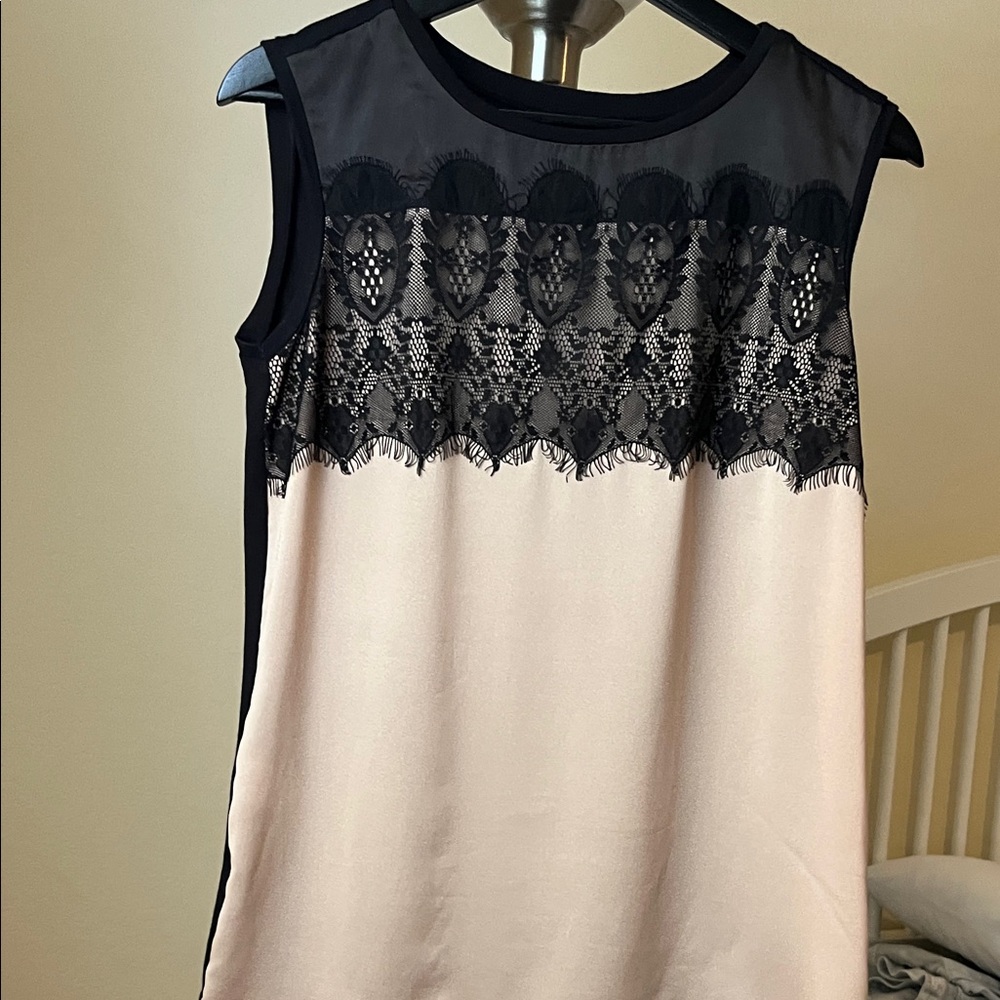 Elegant Black and Cream Sleeveless Top